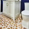 Brown and white hexagonal floor tiles in a bathroom