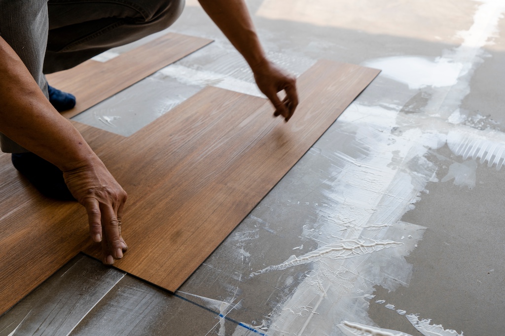 Homeowner interlocking floating tile floor in living room.