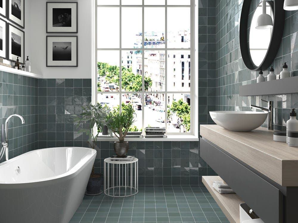 Modern bathroom with blue wall and floor tiles