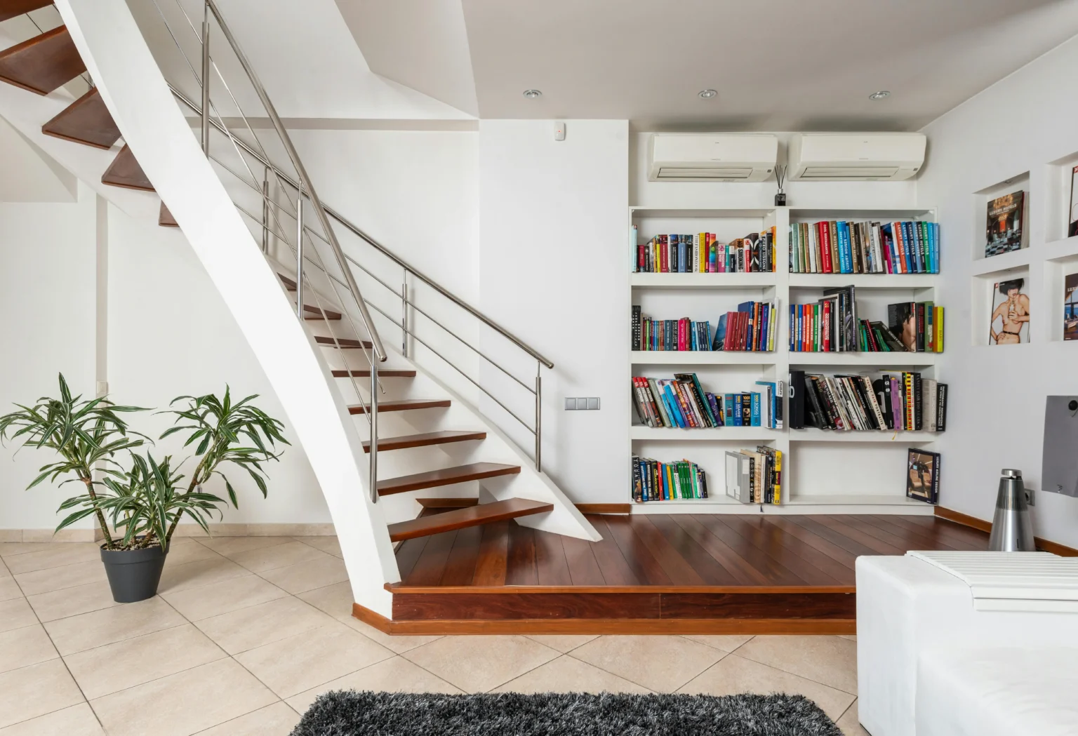 Tile floor with a staircase and book shelf