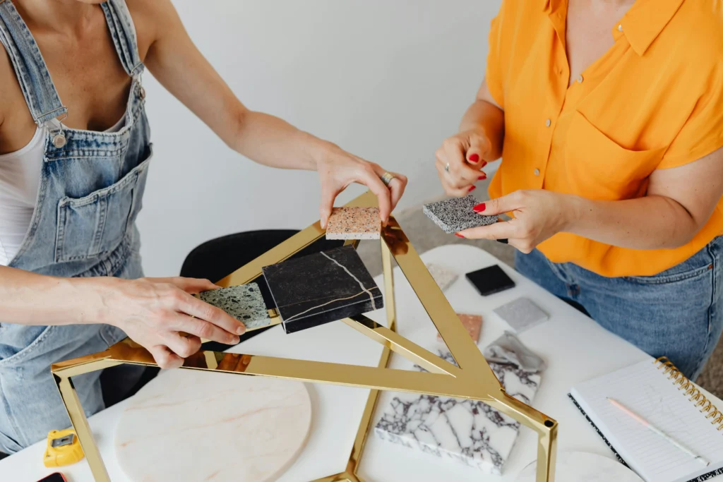 Two women looking at tile samples